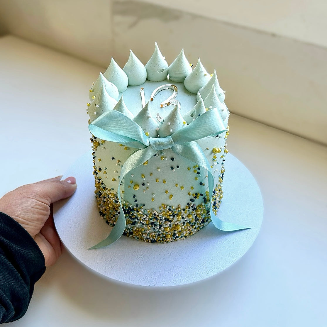 Blue sprinkle age cake bow 